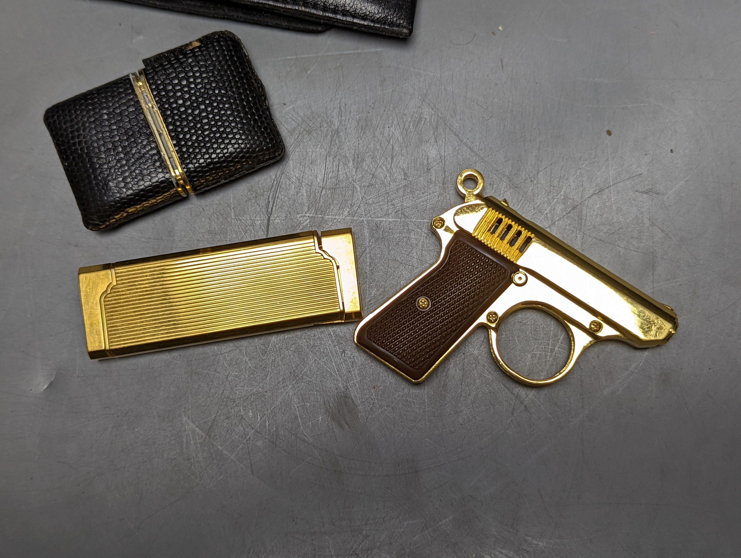 Dunhill and other wallets, novelty pistol lighter, etc.